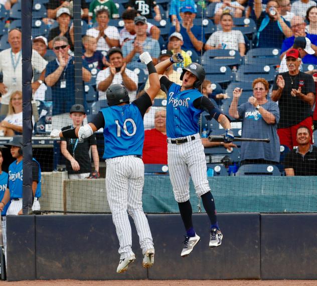 Jason Lopez and Pablo Olivares celebrate for the Tampa Tarpons