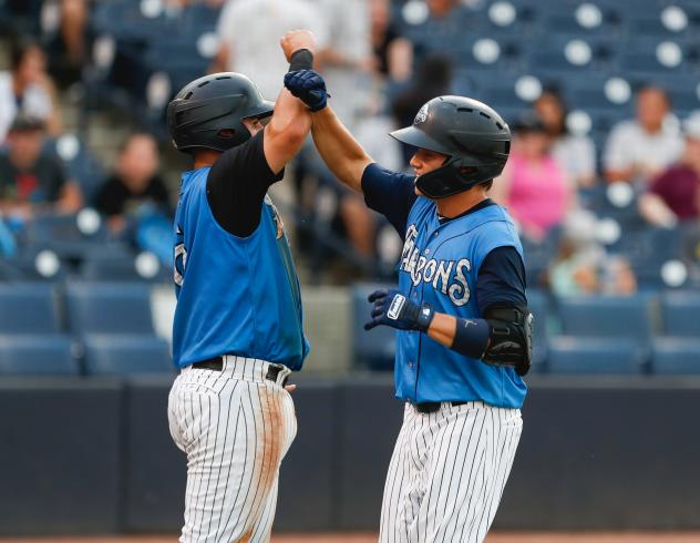 Michey Gasper and Diego Garcia celebrate for the Tampa Tarpons