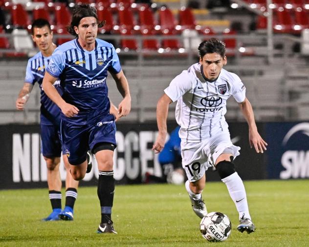 San Antonio FC midfielder Cristian Parano (right) vs. Fresno FC