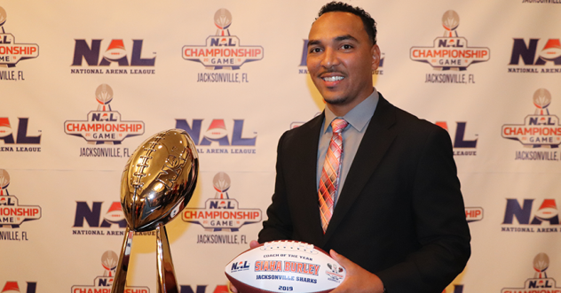 Jacksonville Sharks head coach Siaha Burley with the Coach of the Year award