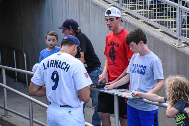 Trevor Larnach of the Pensacola Blue Wahoos signs autographs