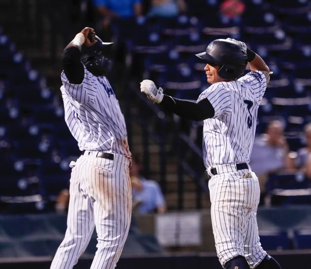 Estevan Florial and Oswaldo Cabrera celebrate for the Tampa Tarpons