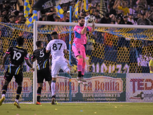 Las Vegas Lights FC goalkeeper Thomas Olsen makes a leaping save