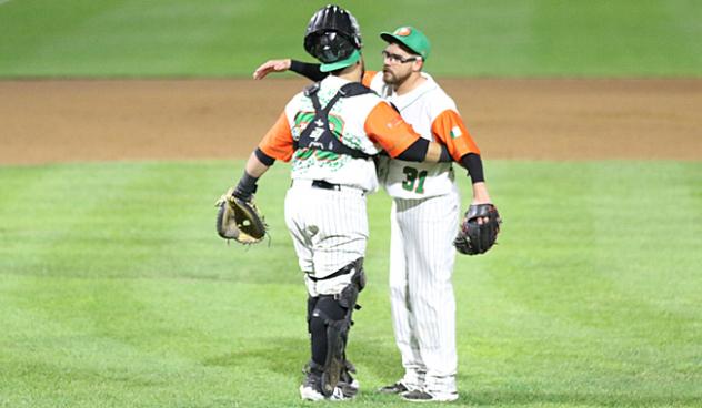 Long Island Ducks pitcher Seth Simmons gets a hug from catcher Ramon Cabrera