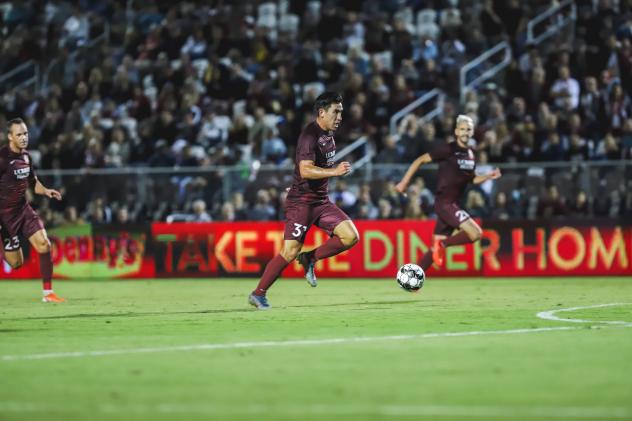 Sacramento Republic FC forward Cameron Iwasa with possession vs. Tacoma Defiance