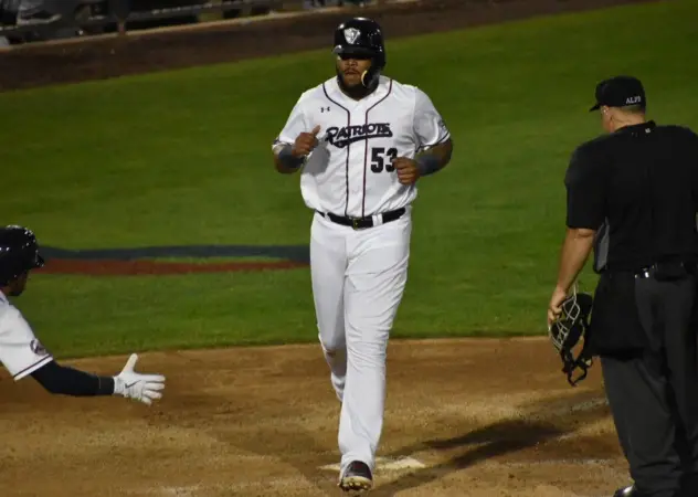 Edwin Espinal of the Somerset Patriots crosses home plate