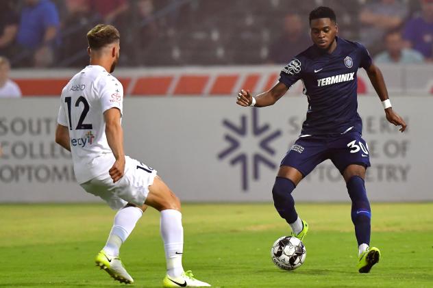 Marcus Epps of Memphis 901 FC with possession against Saint Louis FC