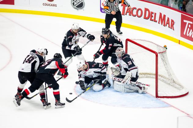Prince George Cougars battle in front of the Vancouver Giants net