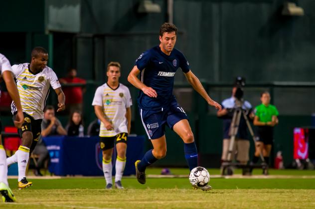 Elliot Collier of Memphis 901 FC eyes the ball against Pittsburgh Riverhounds SC