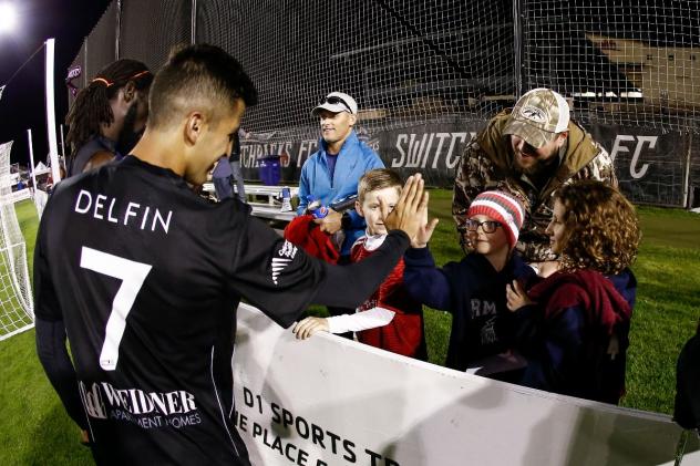 Colorado Springs Switchbacks FC forward Fernando Gonzalez Delfin greets young fans