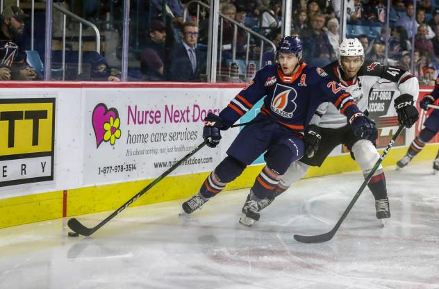 Vancouver Giants centre Justin Sourdif (right) against the Kamloops Blazers