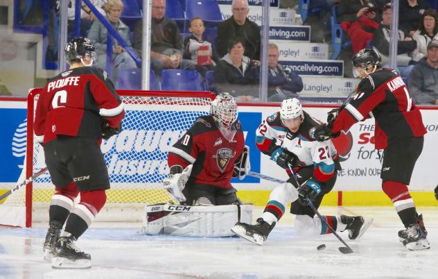 Kelowna Rockets left wing Dillon Hamaliuk pressures the Vancouver Giants