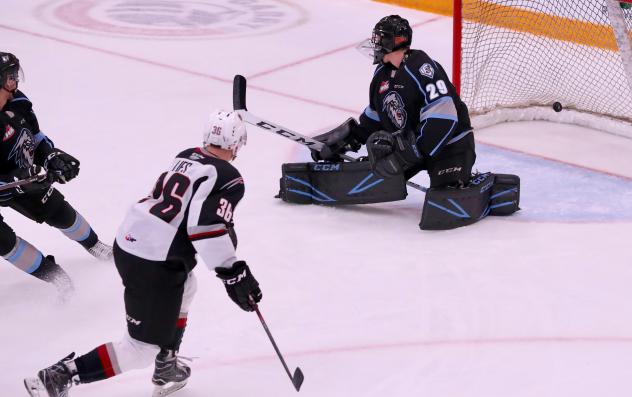 Justin Lies of the Vancouver Giants scores against the Winnipeg ICE