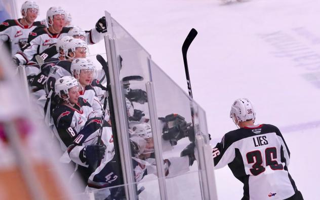 Justin Lies of the Vancouver Giants gets high fives from the bench following his goal