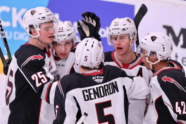 Vancouver Giants huddle up to celebrate a goal