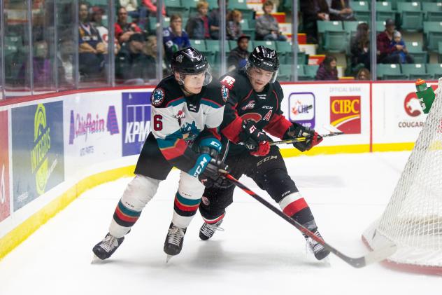 Kelowna Rockets defenceman Cayde Augustine (right) battles the Prince George Cougars