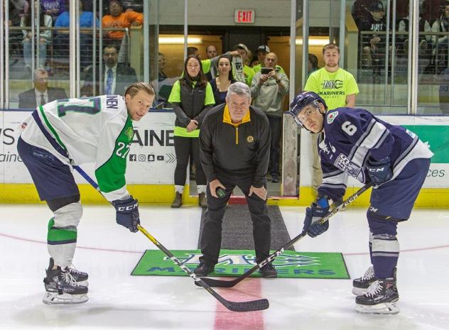 Dale Arnold prepares to drop the puck at 