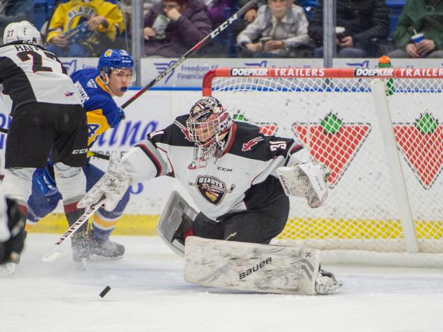 Vancouver Giants goaltender Trent Miner makes a stop against the Saskatoon Blades