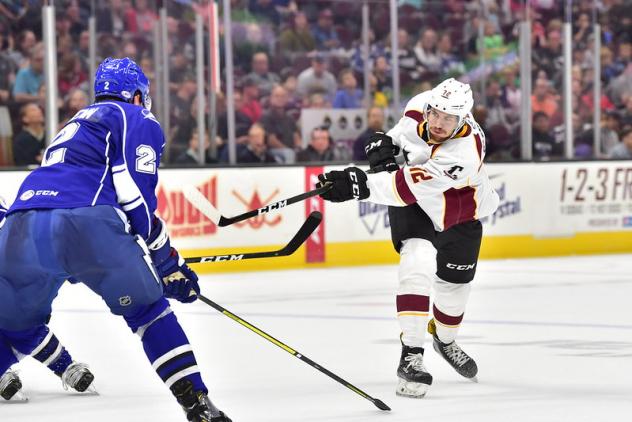 Cleveland Monsters center Ryan MacInnis takes a shot against the Syracuse Crunch