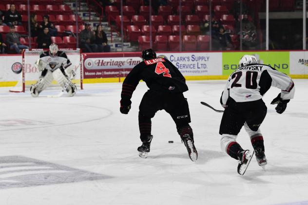 Vancouver Giants right wing Lukas Svejkovsky (right) chases the Moose Jaw Warriors