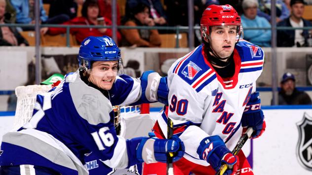Kitchener Rangers centre Liam Hawel (right) vs. the Sudbury Wolves