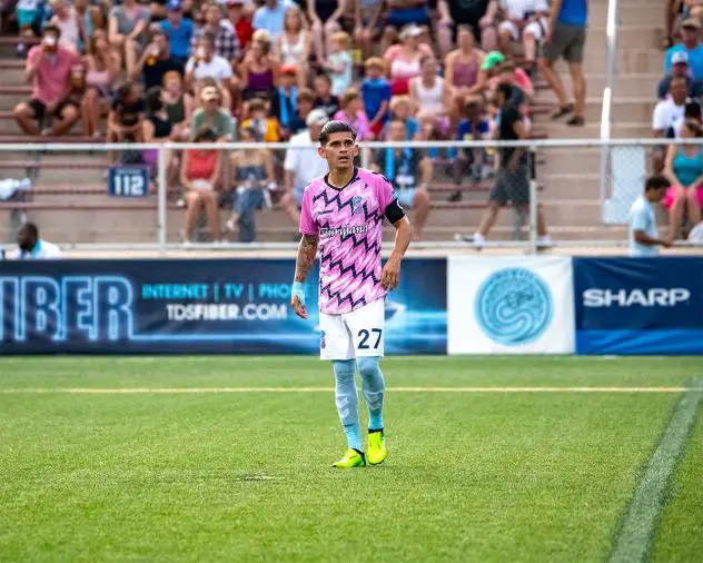 Forward Madison FC defender Christian 