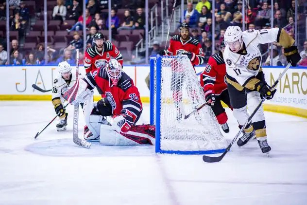 Newfoundland Growlers forwards Colt Conrad (far left) and Justin Brazeau (far right) test the Brampton Beast defense