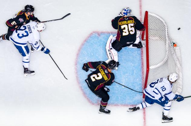 Clevelenad Monsters goaltender Veini Vehvilainen (35) and his defense battle the Toronto Marlies