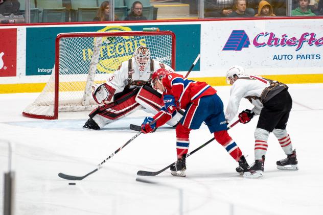 Spokane Chiefs center Bear Hughes skates in on the Prince George Cougars