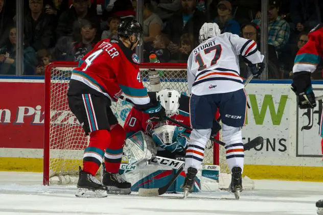 Kelowna Rockets goaltender Roman Basran smothers a shot against the Kamloops Blazers