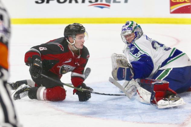 Vancouver Giants center Tristen Nielsen (left) vs. the Swift Current Broncos