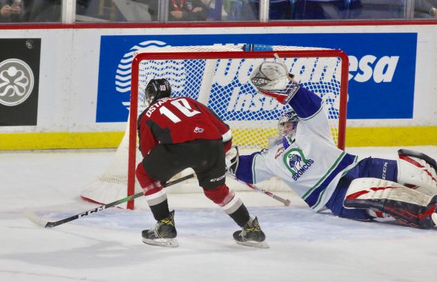 Vancouver Giants left wing Zack Ostapchuk eyes the goal vs. the Swift Current Broncos