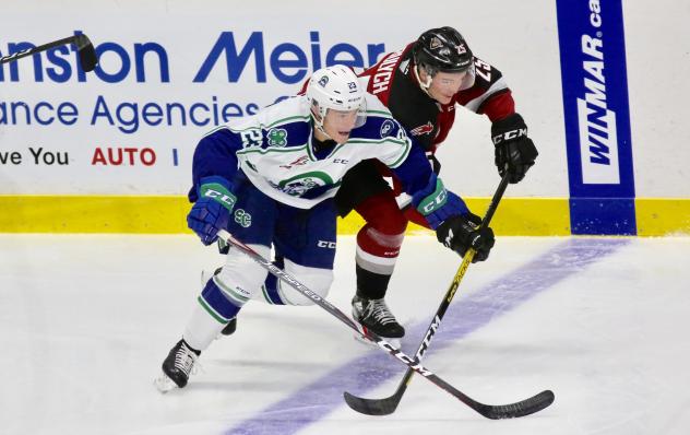 Vancouver Giants defenceman Caleb Bulych (top) vs. his brother Aiden of the Swift Current Broncos