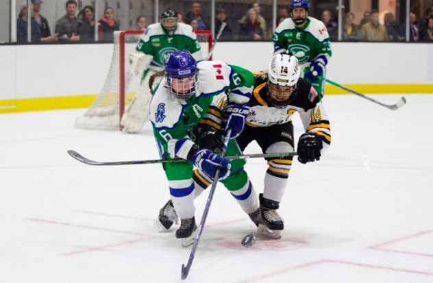 Shannon Doyle of the Connecticut Whale (left) battles for the puck