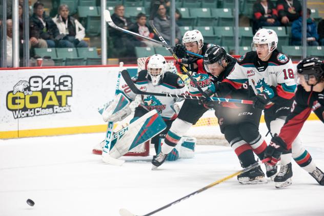 Kelowna Rockets goaltender Roman Basran and his defense against the Prince George Cougars