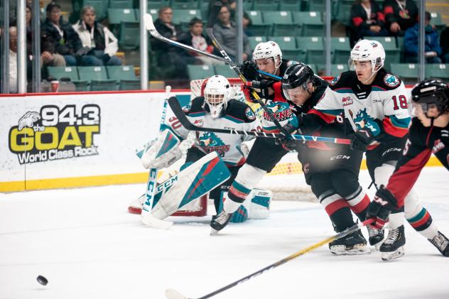 Prince George Cougars pressure the Kelowna Rockets