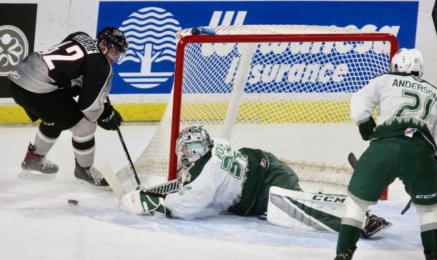 Vancouver Giants centre Justin Sourdif tries to sneak one past the Everett Silvertips