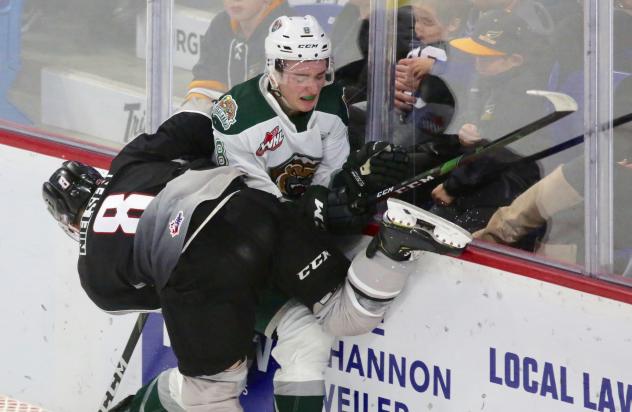 Vancouver Giants centre Tristen Nielsen slams an Everett Silvertip against the boards