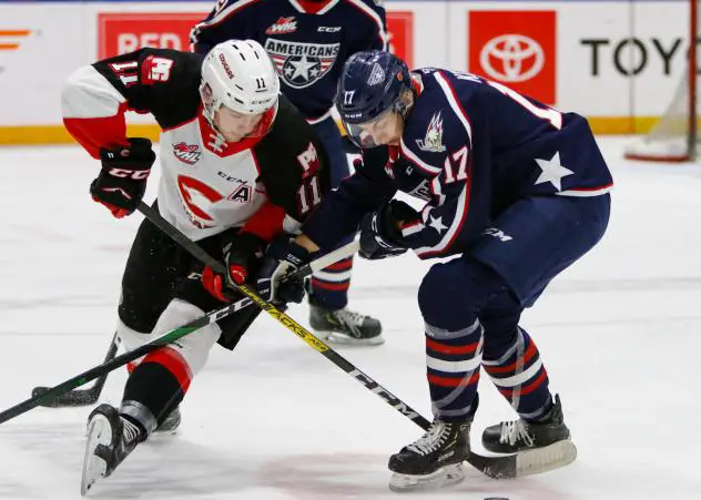 Prince George Cougars left wing Josh Maser (left) against the Tri-City Americans