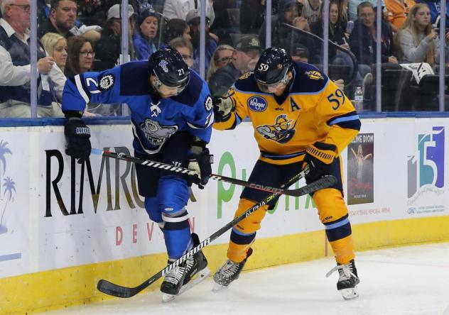 Atlanta Gladiators forward Eric Neiley (right) battles the Jacksonville IceMen along the boards