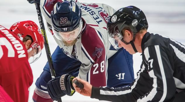 ECHL linesman Michael Miggans (right)