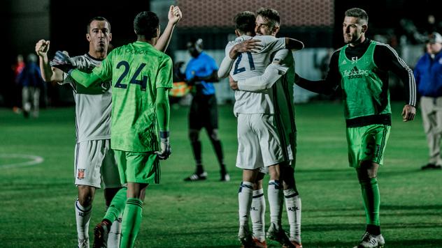 Real Monarchs SLC exchange congratulations after upsetting Phoenix FC in the playoffs