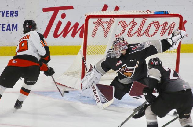 Vancouver Giants goaltender Trent Miner stretches to make a save against the Medicine Hat Tigers