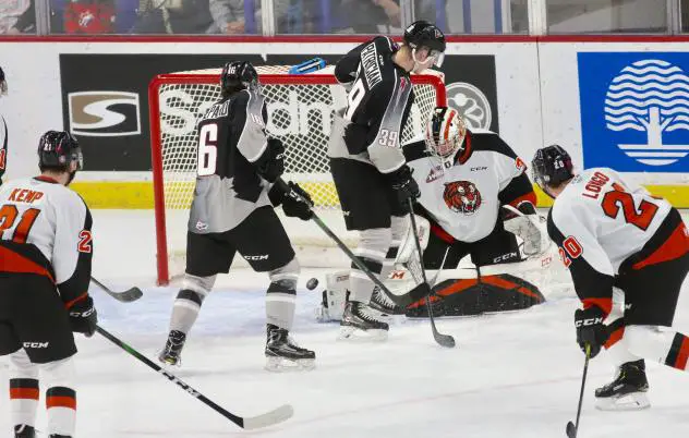 Vancouver Giants centre Evan Patrician (39) and centre Cole Shepard in front of the Medicine Hat Tigers goal