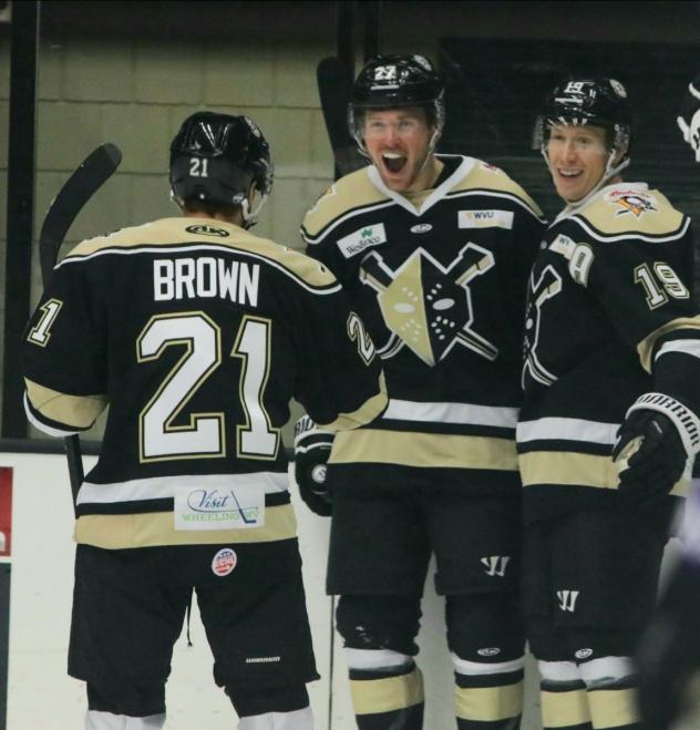 Christopher Brown and the Wheeling Nailers celebrate a goal