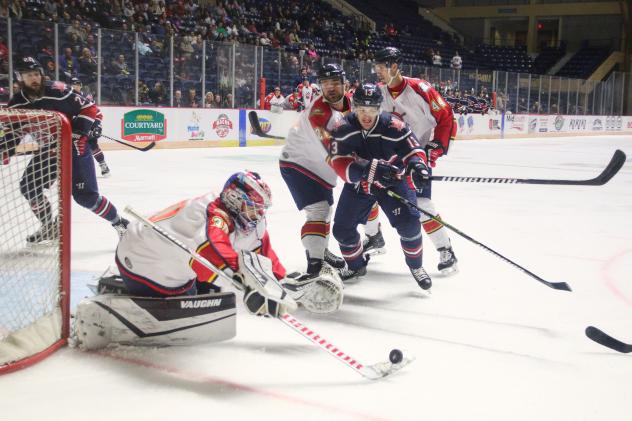 Peoria Rivermen goaltender Jeremy Brodeur knocks aside a Macon Mayhem shot