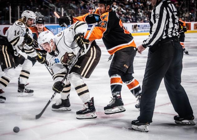 Lehigh Valley Phantoms forward Morgan Frost (right) battles the Hershey Bears