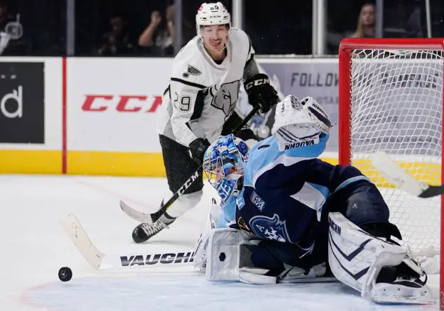Jordan Kyrou of the San Antonio Rampage is stopped by Milwaukee Admirals goaltender Troy Grosenick