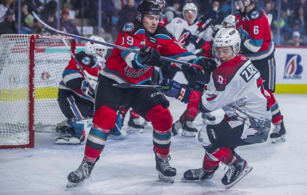 Kelowna Rockets center Ethan Ernst takes on the Kamloops Blazers