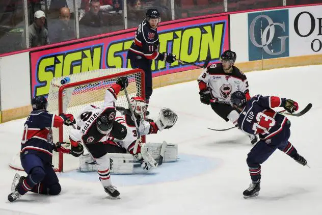 Jarret Kup of the Macon Mayhem (right) takes a shot against the Birmingham Bulls